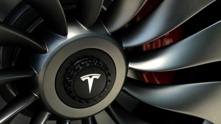 Tesla logo on car wheel