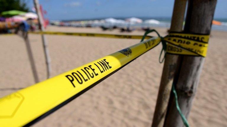 Police cordon at the site in Kuta beach where a policeman was killed