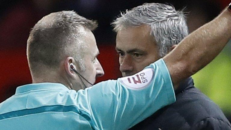 Referee Jon Moss (left) and Man Utd boss Jose Mourinho