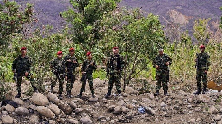 Venezuelan National Guard members are deployed on their side of the Tachira river on 26 August, 2015.