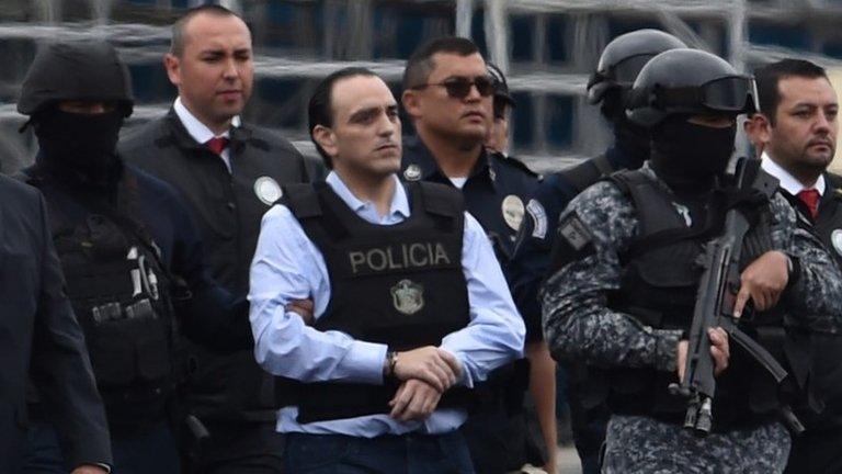 The former governor of the Mexican state of Quintana Roo, Roberto Borge (C) is escorted by the police during his extradition to Mexico, at Panama City"s Tocumen international airport on January 4, 2018