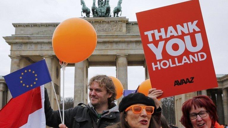 Demonstrators in Germany welcome the result of the Dutch election, 16 March 2017