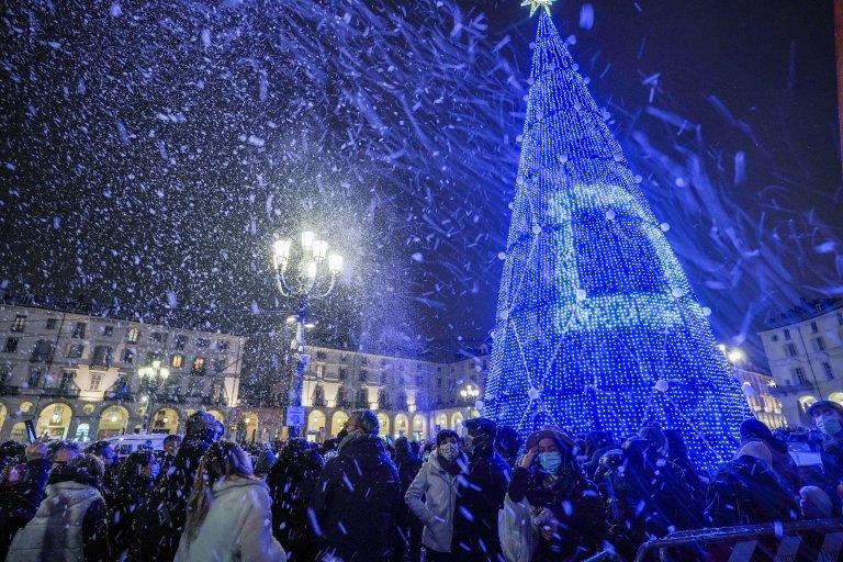 People attend the lightening ceremony of Turin's official Christmas tree, in Turin,