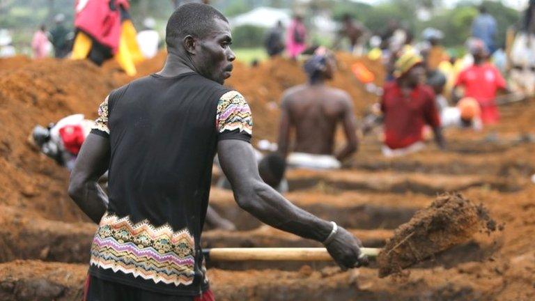 Man digging grave