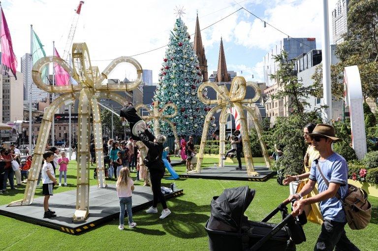 people gathering at Federation Square in Melbourne