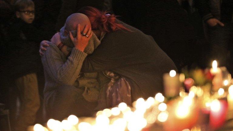 Mourners in France for those killed in the Paris attacks, 14 November 2015