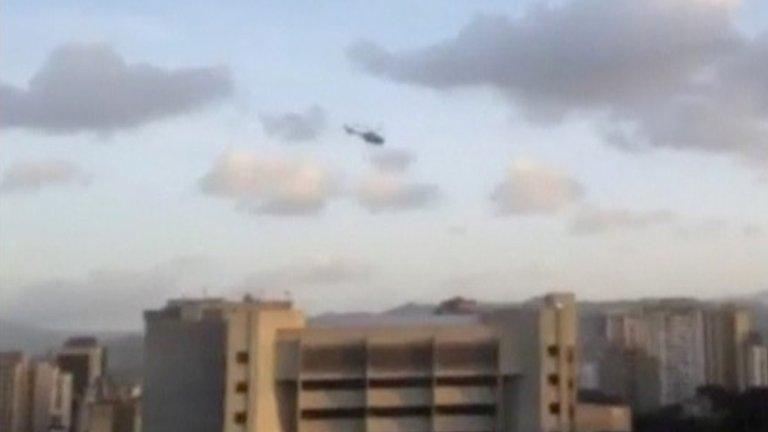 A police helicopter flies over Venezuela"s Supreme Court building in Caracas June