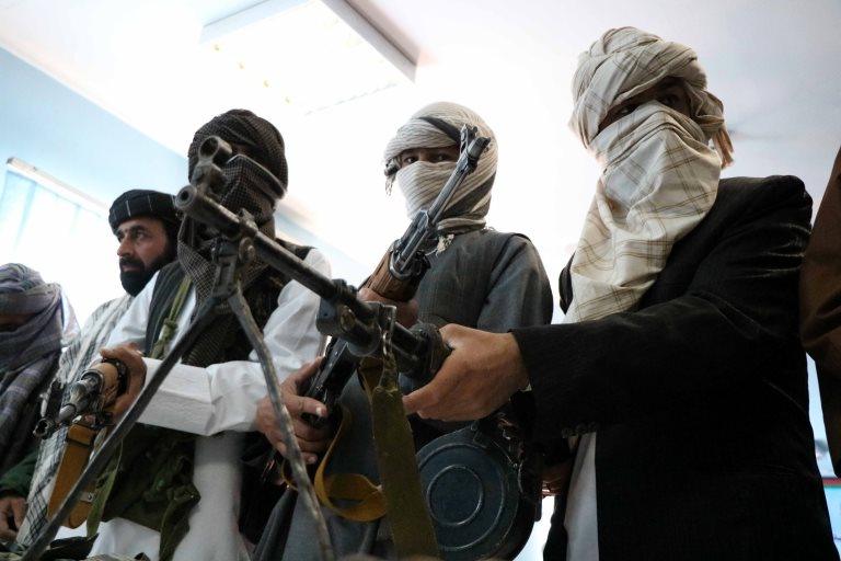 Former Taliban members surrender their weapons during a reconciliation ceremony in Herat, Afghanistan, 21 February 2018.