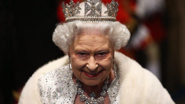 The Queen arrives for the State Opening of Parliament in 2013