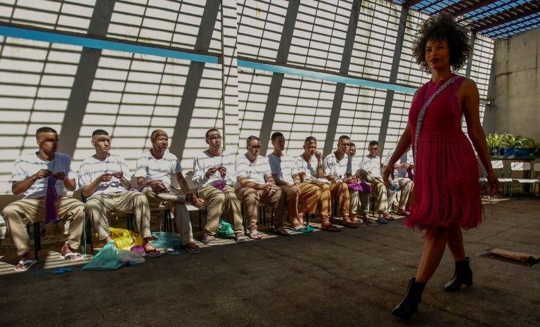 A model presents a creation as inmates crochet clothing as part of "Ponto Firme" project in the Adriano Marrey maximum security penitentiary in Guarulhos, Brazil on May 22, 2019