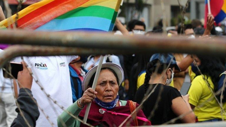 Supporters of the Ecuadorean presidential candidate Yaku Perez wait in front of the headquarters of the National Electoral Council (CNE), during a meeting between candidates, in Quito, Ecuador, 12 February 2021