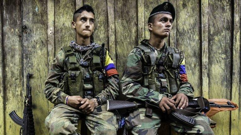 Revolutionary Armed Forces of Colombia (FARC) members rest at a camp in the Magdalena Medio region, Antioquia department, 16 March 2016