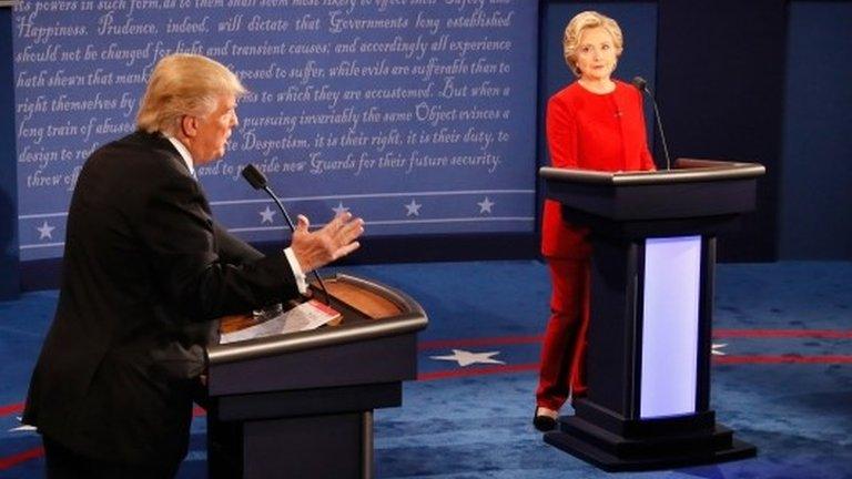 Republican presidential nominee Donald Trump (L) speaks as Democratic presidential nominee Hillary Clinton (R) listens during the Presidential Debate at Hofstra University on September 26, 2016 in Hempstead, New York.