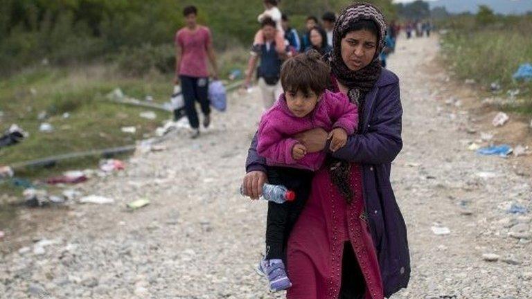 Migrants and refugees arrive at a registration camp, after crossing the Greek-Macedonian border, near Gevgelija on October 7, 2015