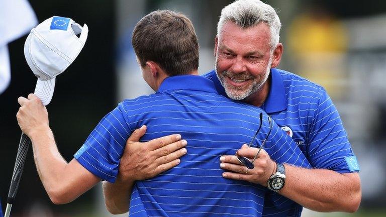 Europe captain Darren Clarke celebrates with Matt Fitzpatrick