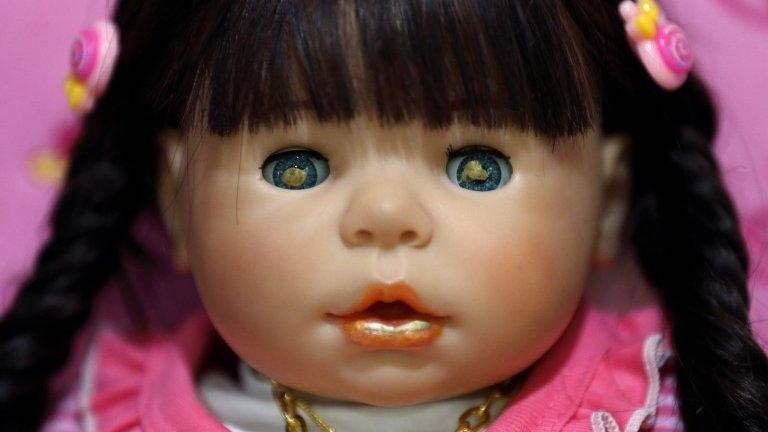 A picture made available on 25 January 2016 shows a Child Angels Dolls painted with holy gold sheets in its eyes and mouth,