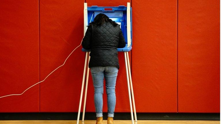 Voter completes her ballot in Wisconsin