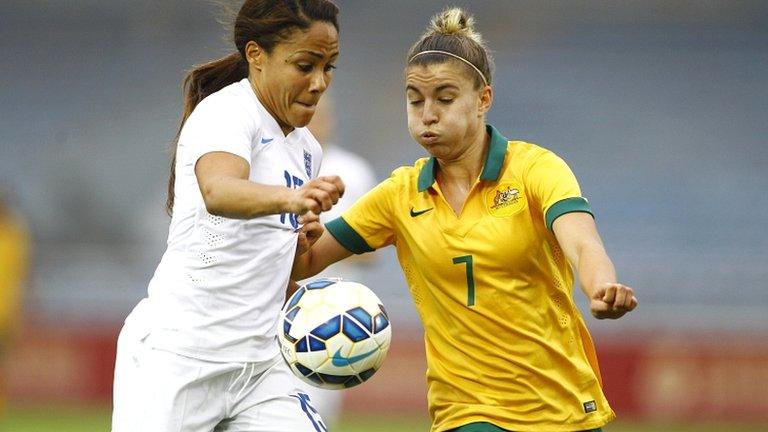 Alex Scott battles with Australia's Stephanie Catley