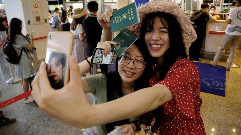 People take part in a flight to nowhere in Taiwan