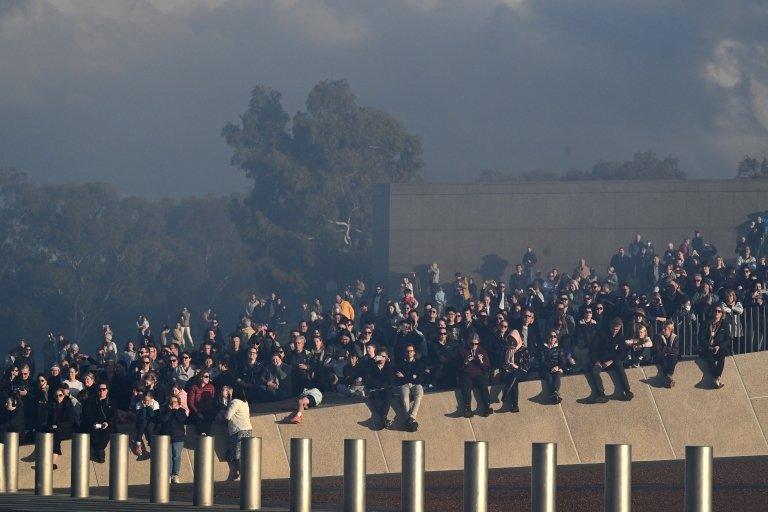 In Canberra, Australia, crowds gathered to watch a gun salute to Elizabeth II at Parliament House