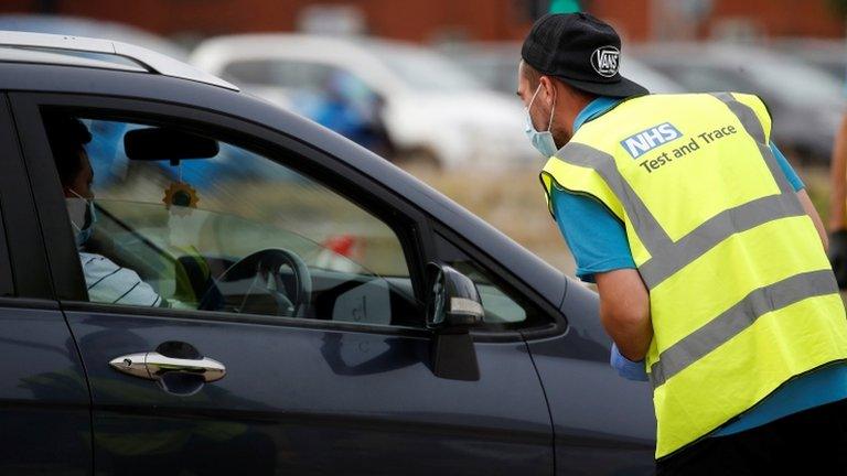 A man arrives at a drive-through test facility following the outbreak of the coronavirus disease (COVID-19) in Bolton