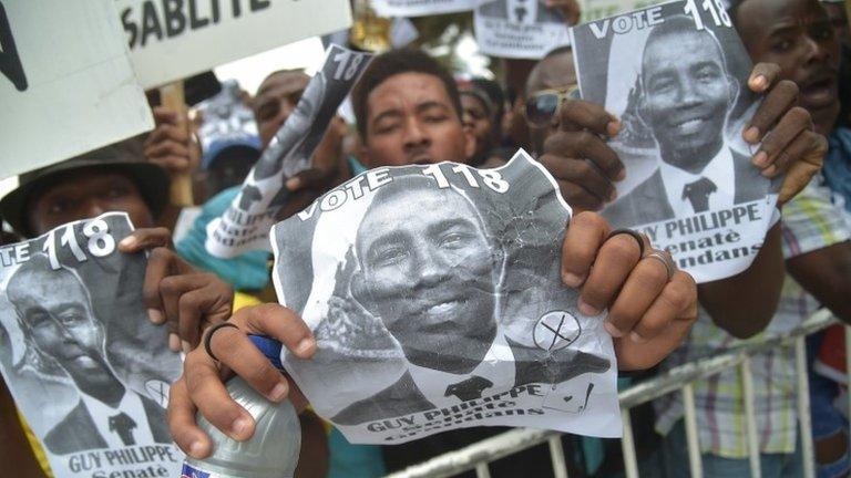 Guy Philippe supporters at a rally outside Haiti's parliament after his arrest, 9 Jan 2017