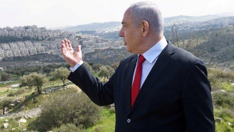 Benjamin Netanyahu gestures towards Israeli settlement of Har Homa (20/02/20)