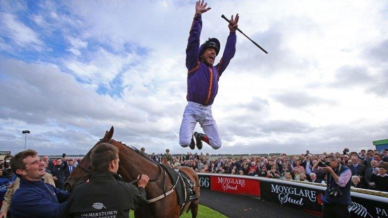 Frankie Dettori celebrates with a flying dismount from Wicklow Brave