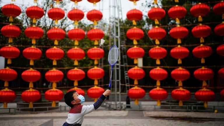 Boy plays badminton in Wuhan street - 8 February