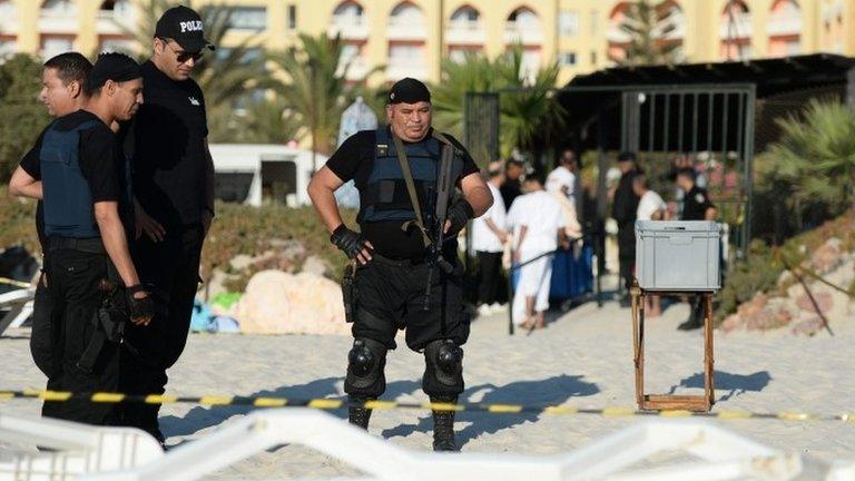 Armed officers on the beach in Sousse