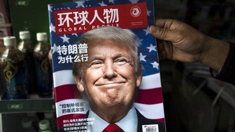 This file photo taken on November 14, 2016 shows a copy of the local Chinese magazine Global People with a cover story that translates to "Why did Trump win" at a news stand in Shanghai.