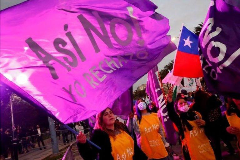 Flags and banners reading "I reject" are seen as demonstrators gather to show their rejection during a meeting ahead of the upcoming September 4th referendum, where Chileans will vote to approve or reject the proposed new constitution, in Vina del Mar, Chile, August 31, 2022.