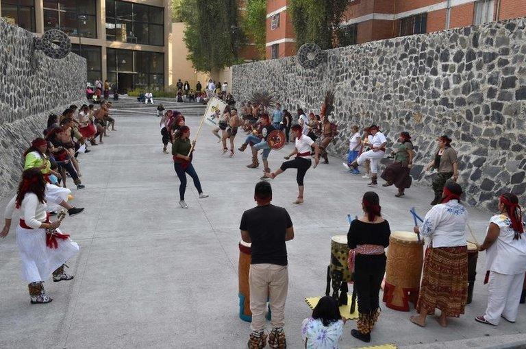 Dancers and players perform ahead of a game of Ulama in Mexico City on 21 August, 2019.