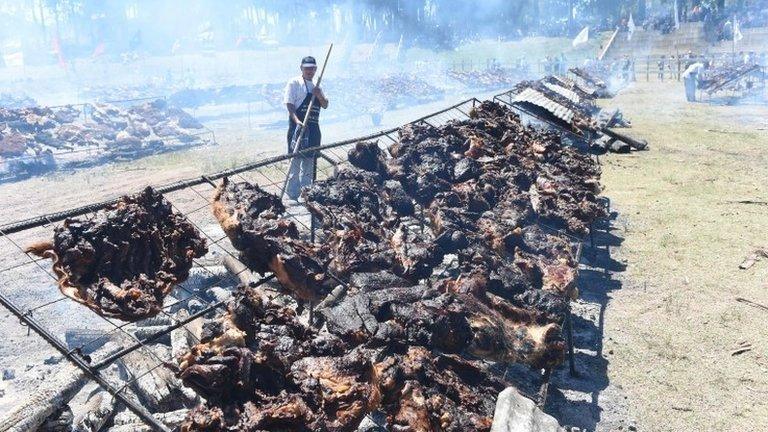 A total of 16,500 kg of beef are grilled in Rodo Park in Minas, Uruguay, 120 km from Montevideo, in an attempt to break the Guinness record for "The World" s Biggest Barbecue", on December 10, 2017.