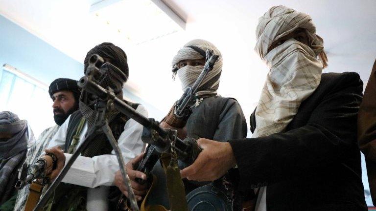 Former Taliban members surrender their weapons during a reconciliation ceremony in Herat, Afghanistan, 21 February 2018.