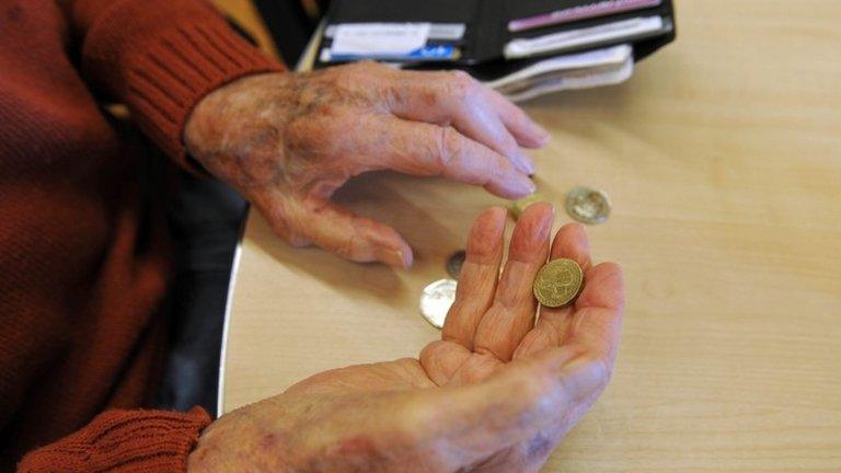 Pensioner counting money