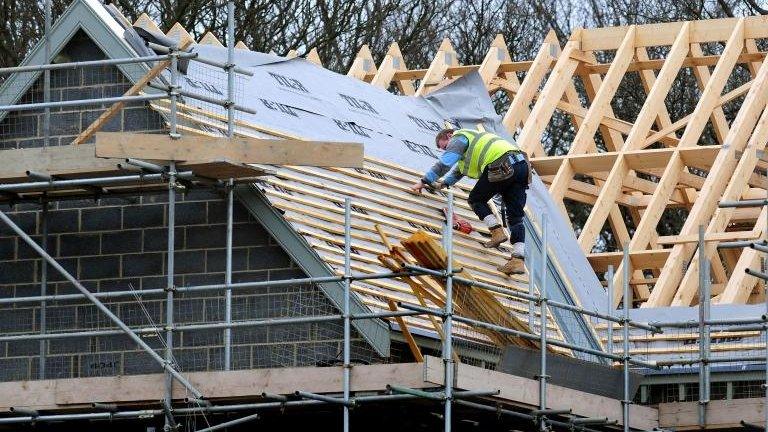 Construction worker on roof