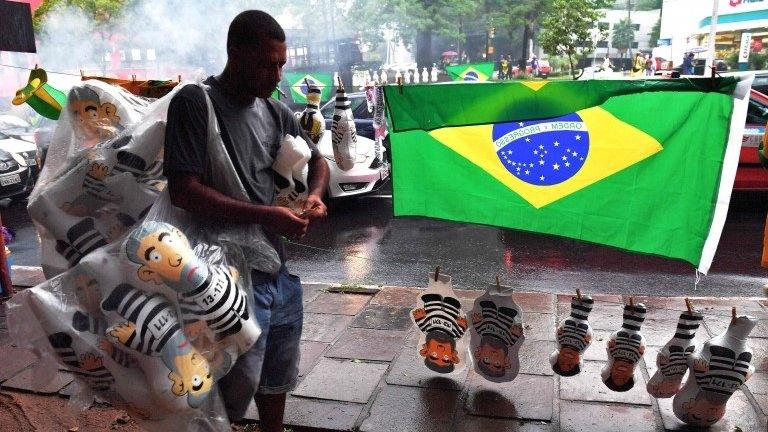 A vendor sells inflatable dolls depicting former Brazilian president Luiz Inacio Lula da Silva in a prison uniform in Porto Alegre, in the state of Rio de Grande do Sul, Brazil on January 24, 2018.