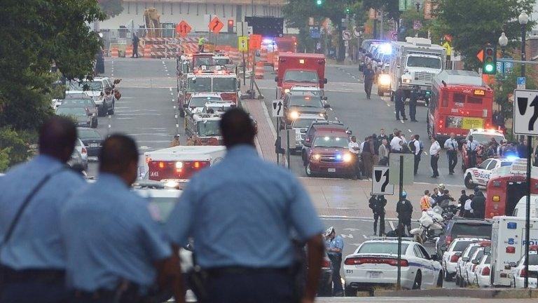 Police near the scene of the Washington Navy Yard shooting in Washington DC on 16 September 2013