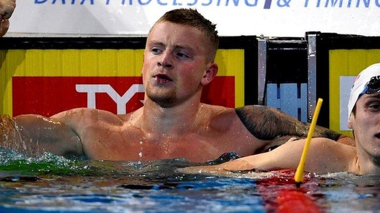 Britain's Adam Peaty celebrates.