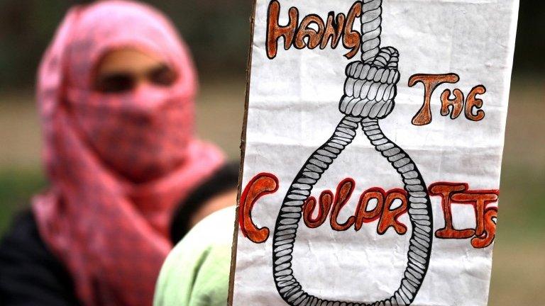 A student of All Ladakh Association of Kashmir hold a placard during a protest calling for justice in the rape and murder case of an eight-year-old nomadic girl in Srinagar, the summer capital of Indian Kashmir, 16 April 2018