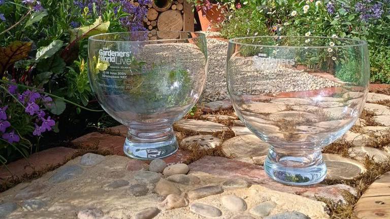 Two glass bowls inscribed with "BBC Gardeners' World Live"