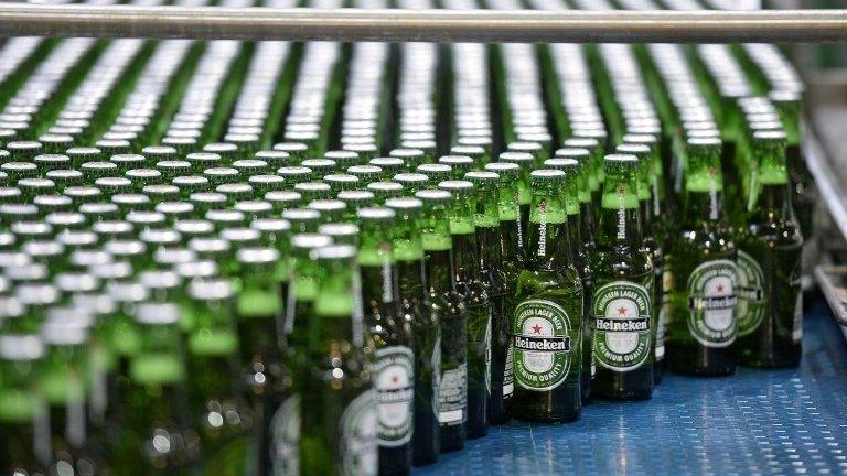 Heineken bottles on factory line