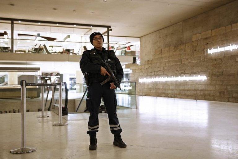 A French policeman stands guard inside The Louvre Museum, Paris, on 3 February 2017