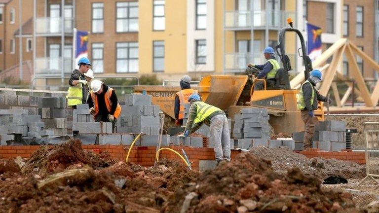 Builders working on a building site