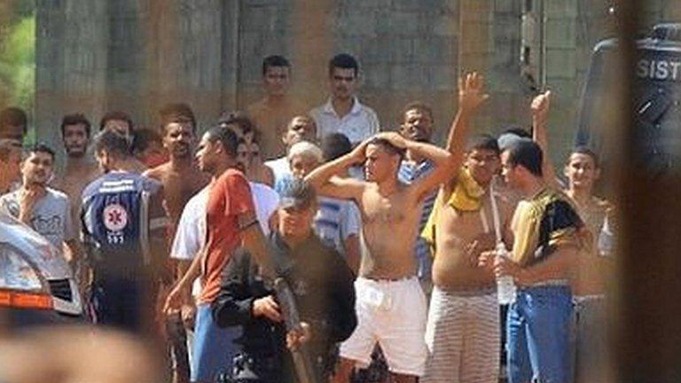 A handout photo made available by O Popular shows a group of inmates guarded by the authorities at a prison in the metropolitan region of Goiania, capital of the Brazilian state of Goias, Brazil, 01 January 2018.