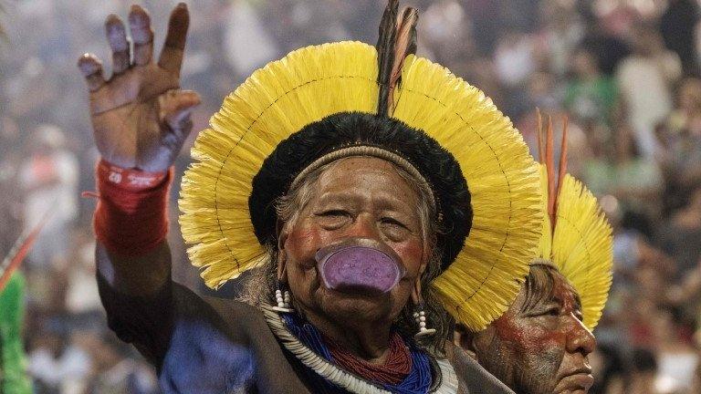 The leader of the Kayapo indigenous people Raoni Metuktire (L) and Megaron Txucarramae parade with the Imperatriz Leopoldinense samba school during the first night of Rio"s Carnival at the Sambadrome in Rio de Janeiro, Brazil, early on February 27, 2017