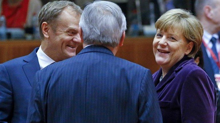 Donald Tusk, left, with Angela Merkel