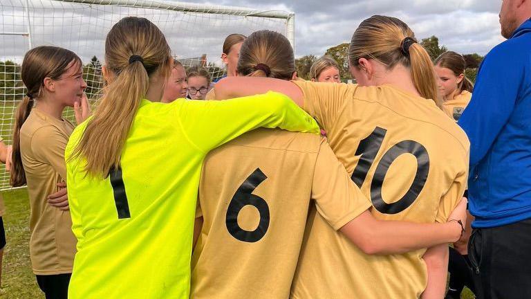 Girls celebrating after a game