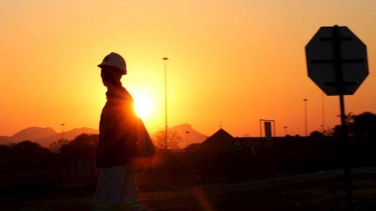 A miner returns from his shift in Nkaneng township outside the Lonmin mine in Rustenburg,